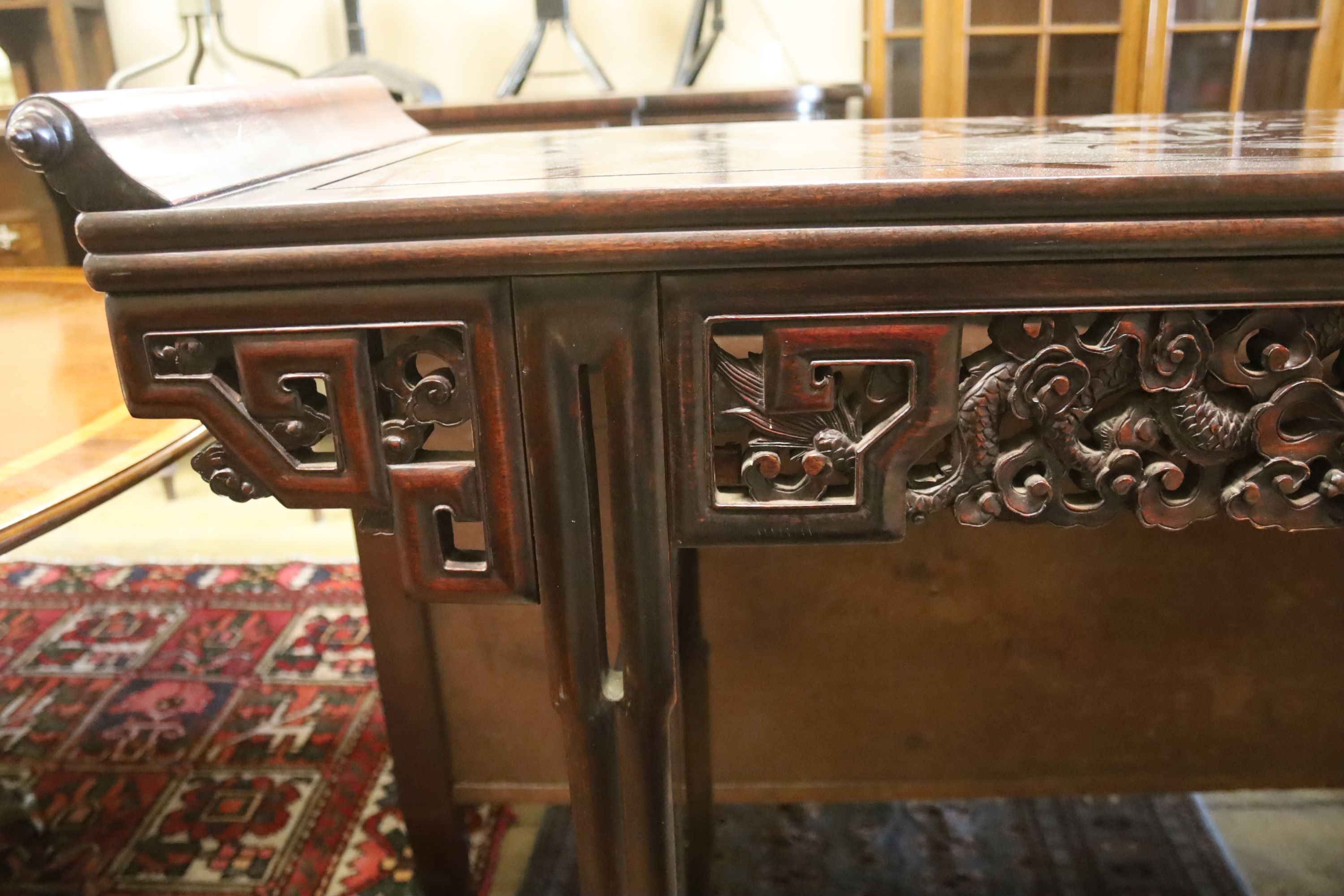 A Chinese altar table, width 150cm, depth 45cm, height 102cm